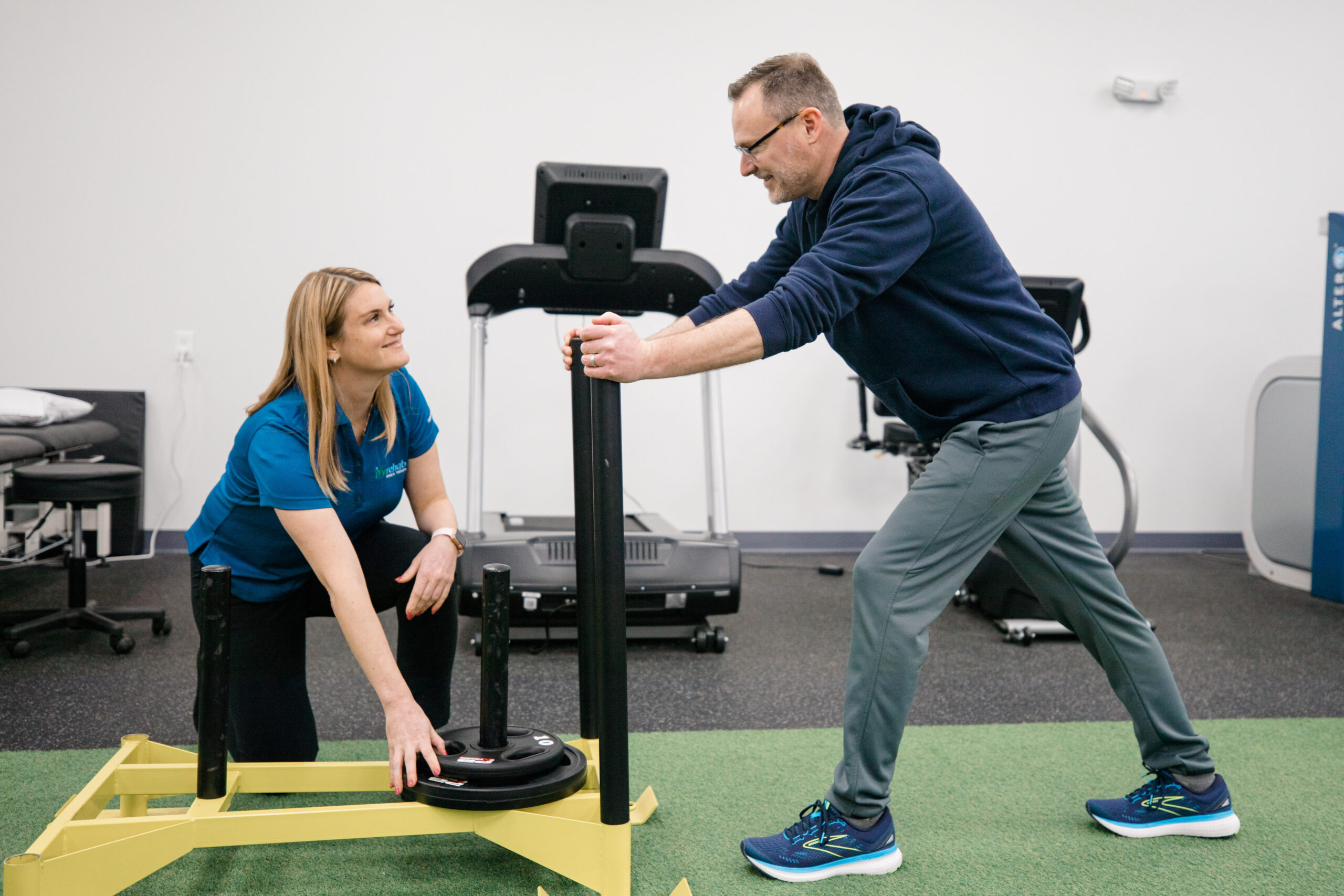 Clinician performing post-offer employment testing to assess workplace physical abilities