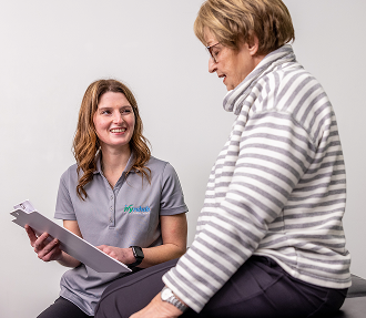 Ivy Health clinician reviewing a care plan with a patient during a therapy appointment